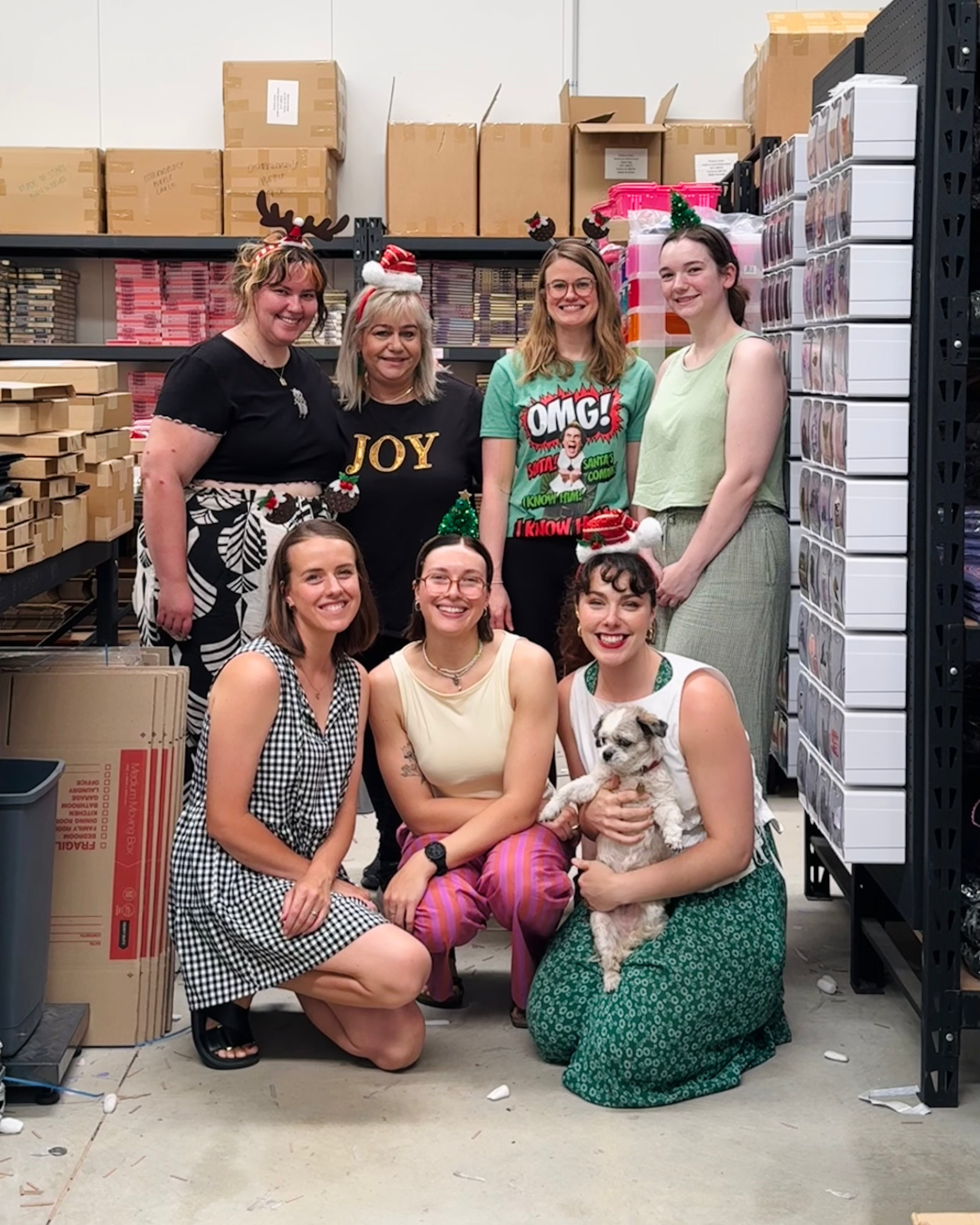 The Quirky Cup Collective team, all dressed in various Christmas attire.