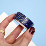 Roll of blue washi tape with pink flowers, light blue accents, diamonds, filagree and gold foil