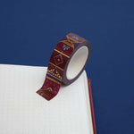 Roll of red washi tape with pink flowers, light and dark blue accents, filagree and gold foil