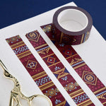 Red washi tape with pink and blue flowers, blue leaves, diamonds and gold foil