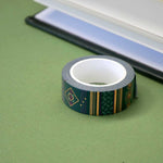 Roll of green washi tape with dark pink flowers, light green leaves and gold foil