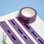 Purple washi tape with blue and gold  flowers, a blue band and gold foil filagree