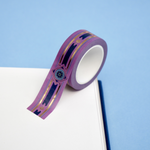 Purple washi tape with blue and gold  flowers, a blue band and gold foil filagree