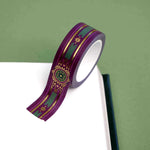 Purple washi tape with pink and gold flowers, a green band and gold foil filagree