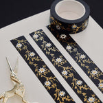 Black washi tape with white flowers and gold foil foliage