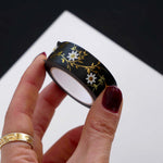 Black washi tape with white flowers and gold foil foliage
