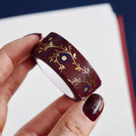Red washi tape with blue flowers and gold foil foliage