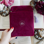 Iridescence Kindle & Reader Sleeve - The Quirky Cup Collective - Pink velvet sleeve with stained glass embroidered design on a background of books, flowers and candles