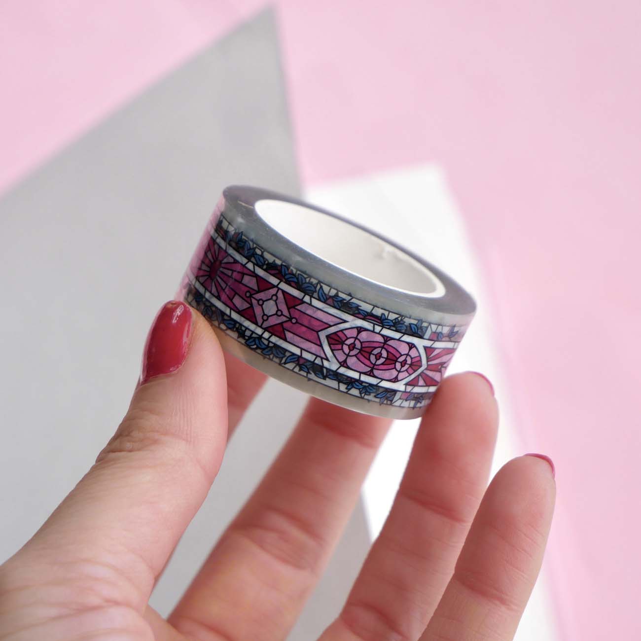 Clear washi tape with a pink panels and green foliage