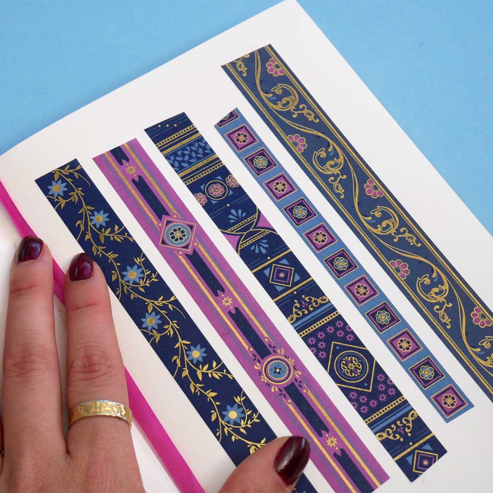 Washi tapes with blue and purple backgrounds with pink and blue flowers and gold foil