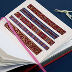 Washi tape with red and blue backgrounds with flowers and gold foil