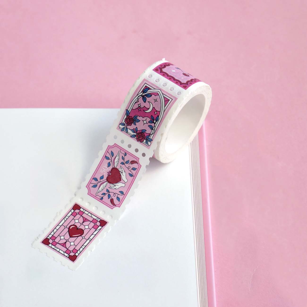 White and pink washi tape with hearts, roses, a crescent moon, leaves and chillies