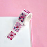 White and pink washi tape with hearts,  roses, a crescent moon, leaves and chillies