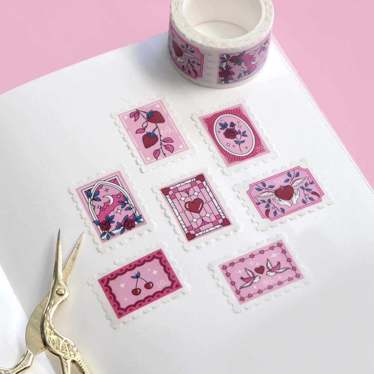 White and pink washi tape with hearts, roses, a crescent moon, cherries, birds and strawberries