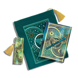 bundle of teal blue stationery items on a plain background. Items are a book sleeve, journal, pen and bookmark. Design features a luna moth with celestial inspired design.