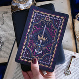 Decorative dark and moody kindle sticker against a dark background e reader