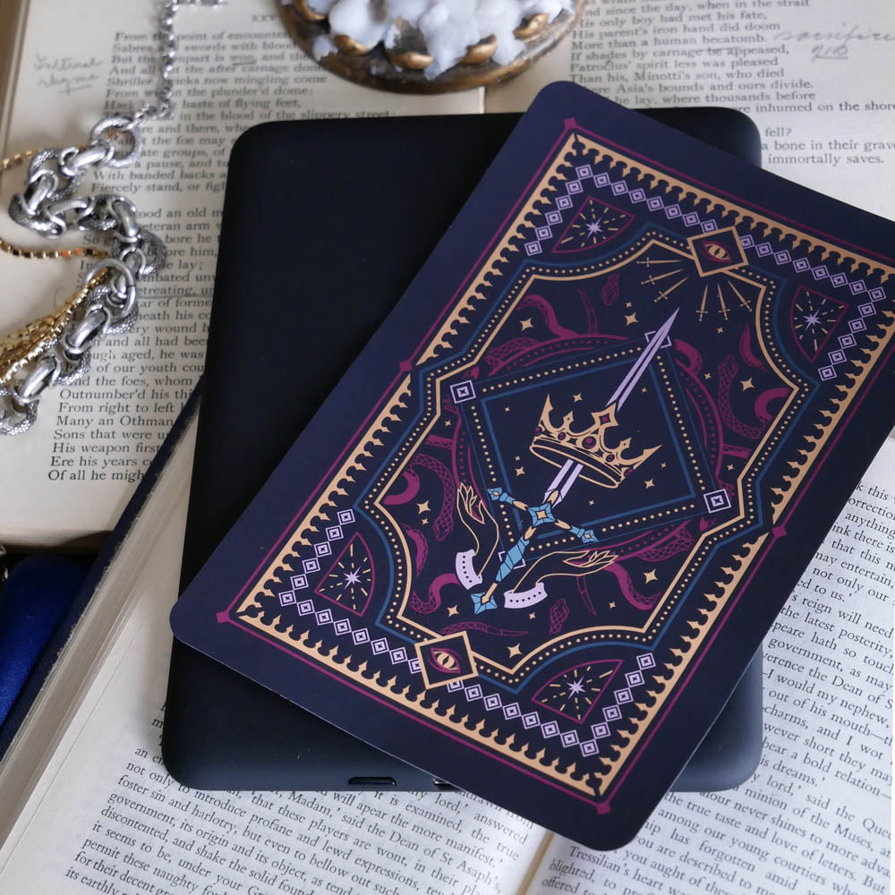 Decorative dark and moody kindle sticker against a dark background e reader