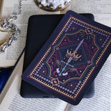 Decorative dark and moody kindle sticker against a dark background e reader