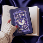 hand holding kindle and purple celestial inspired sticker that adheres to kindle