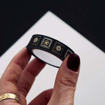 Black washi tape with white and grey flowers in squares outlined in gold foil