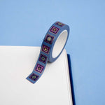 Blue washi tape with blue and purple flowers in pink and blue squares outlined in gold foil