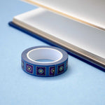 Blue washi tape with blue and purple flowers in pink and blue squares outlined in gold foil