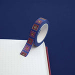 Blue washi tape with red and blue flowers in pink and red squares outlined in gold foil