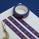 Blue washi tape with red and blue flowers in pink and red squares outlined in gold foil