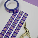 Purple washi tape with pink and purple flowers in light purple and pink squares outlined in gold foil