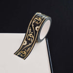Black washi tape with white flowers and gold foil filagree