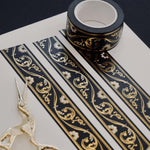 Black washi tape with white flowers and gold foil filagree