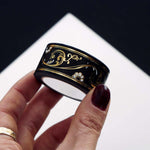 Black washi tape with white flowers and gold foil filagree