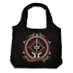 The black fantasy book inspired Serpents & Swords tote bag by The Quirky Cup Collective features a decorative emblem with crown, snake and sword motifs in red, white and gold.