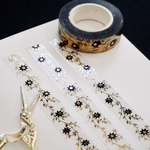 clear washi tape with gold foil foliage and black flowers