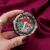 Decorative kindle grip with cottage core design held by a hand against a decorative background