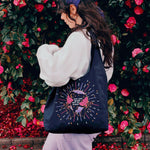 Navy Cotton Reusable Shopping tote bag. Colourful and gold moon and stars stitching embroidery. Eco friendly cotton bag, crystal ball design with 'You Are Made of Stars' text.