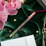 You got this gel pen- black ink- reading journal pen - green and purple - the quirky cup collective