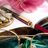 You got this gel pen- black ink- reading journal pen - green and purple - the quirky cup collective