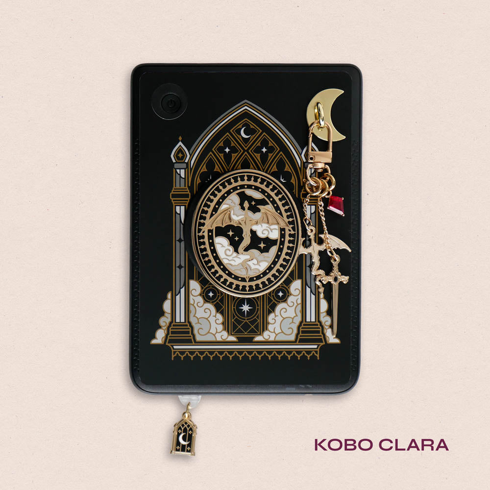 Decorated Kobo Clara with a set of ereader accessories that are gold and feature dragons, moons and celestial themes inside a cathedral window