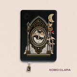 Decorated Kobo Clara with a set of ereader accessories that are gold and feature dragons, moons and celestial themes inside a cathedral window