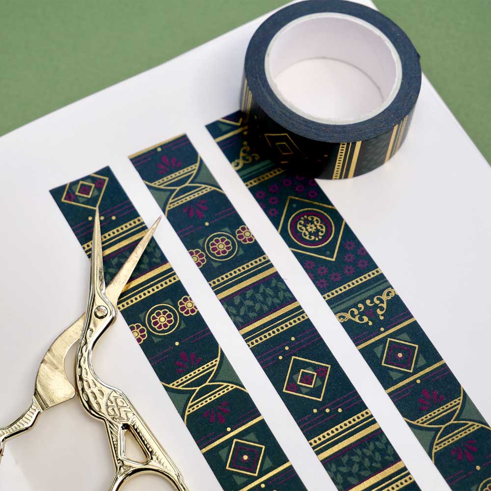 Green washi tape with dark pink flowers, light green leaves, diamonds, filagree and gold foil
