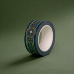 The Sage green variation of the Balteus Literati washi tape. The classic book inspired washi tape design is shown on a green background and features a classic victorian motif with a small flower in shades of dark green, sage green, white and gold.