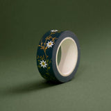 The Sage green variation of the Botanica Literati washi tape. The classic book inspired washi tape design is shown on a green background and features a a vine covered in tiny flowers and leaves in shades of dark green, sage green, white and foiled gold.