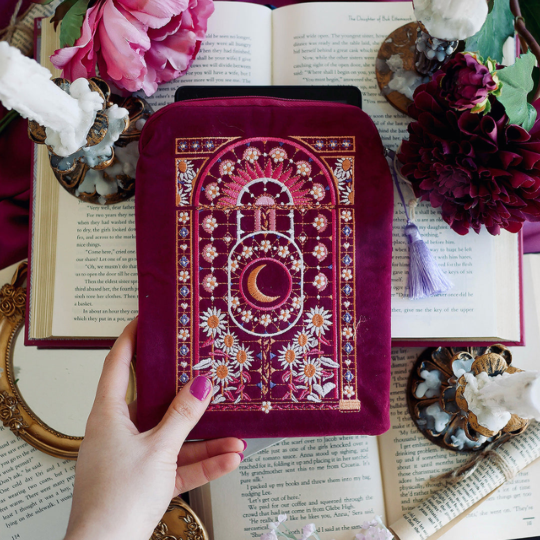 Iridescence Kindle & Reader Sleeve - The Quirky Cup Collective - Pink velvet sleeve with stained glass embroidered design on a background of books, flowers and candles