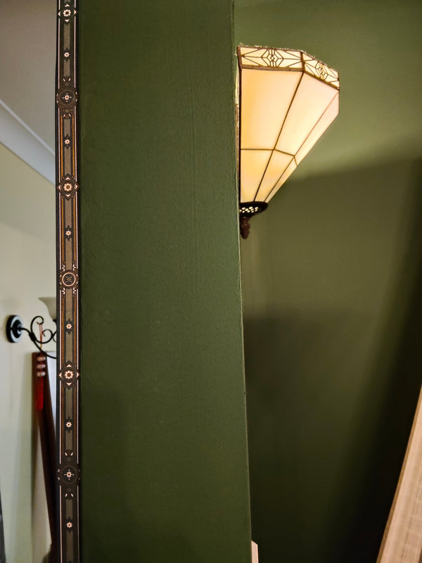 Washi tape used as a decorative edge on a green wall
