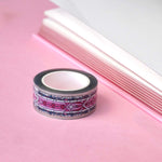 Clear washi tape with a pink panels and green foliage