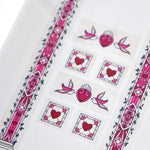 Clear washi tape with a pink panels, hearts and birds, and green foliage