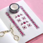 Clear washi tape with a pink panels, hearts and birds, and green foliage