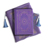 The wisteria journal bundle from the classic book inspired Literati collection. This soft lilac variation includes a book sleeve, journal, pen and bookmark from the collection. All share a slightly Victorian book inspired motif in shades of gold, pink, purple and blue. The foiled journal, pen and bookmark feature intricate gold foiling while the velvet book sleeve is embroidered. The sleeve and bookmark also feature light blue tassels.