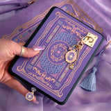 An image of the wisteria literati eReader decor bundle. The set features an eReader sleeve, eReader sticker insert, charmlet and dust plug all in the same light purple colour with pastel pink, purple and blue detailing alongside gold foil and embroidery.